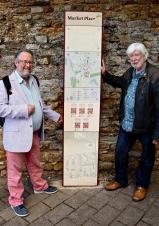 David Brown and Ian Luck with one of the heritage signs.